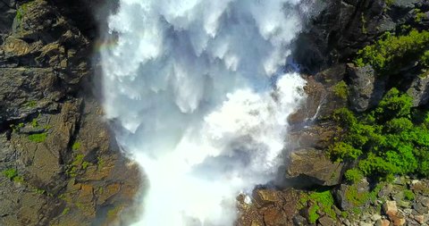Mystic Falls Montana - Drone Aerial Traversing Shot Of White Water Fall On Gray Rocky Cliffs