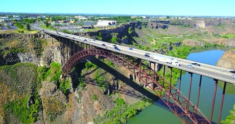 Perrine Bridge, Twin Falls, Idaho - Drone Aerial Traversing View Of Highway Bridge With Cars Driving Over River Canyon
