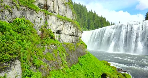 Mesa Falls Montana - Drone Aerial Approaching View Of Waterfalls Surrounded By Green Pine Trees & Gray Granite Cliffs