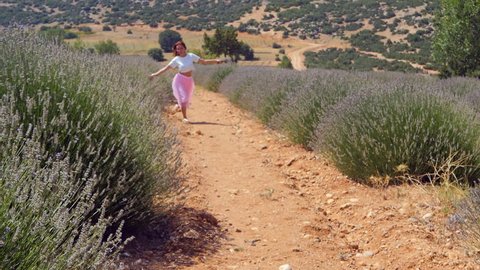 Woman jumping in the lavender field