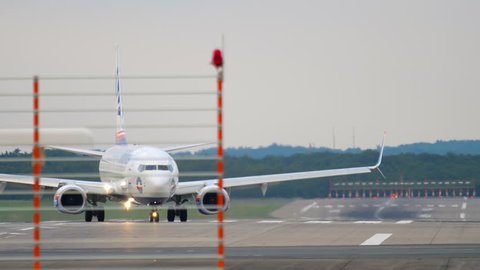 DUSSELDORF, GERMANY - JULY 22, 2017: SunExpress Boeing 737 TC-SEK taxiing after landing. Dusseldorf Airport, Germany