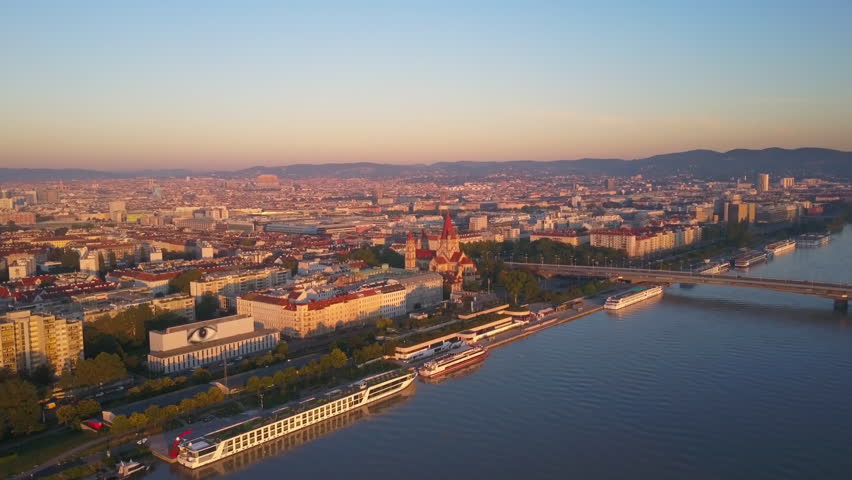 aerial drone flying over vienna city at sunrise leopoldstadt district Royalty-Free Stock Footage #1006947976