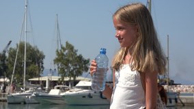 Child Drinking Water on Beach Seaport, Happy Tourist Girl in Summer Vacation 4K