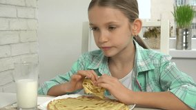 Child Drinking Milk After Eating Pancakes at Breakfast in Kitchen 4K