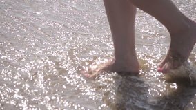 High quality video of woman walking in the water in real 1080p slow motion 250fps
	
