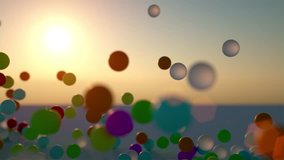 colorful bouncing rubber balls outdoors against clear sunset sky - shot in slow motion - Powered by Shutterstock - Get 15% off with code: PIKWIZARD15
