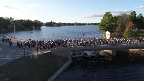 Beginning of a parade. Shot from a drone hovering over Fowler Lake, Oconomowoc Wisconsin.