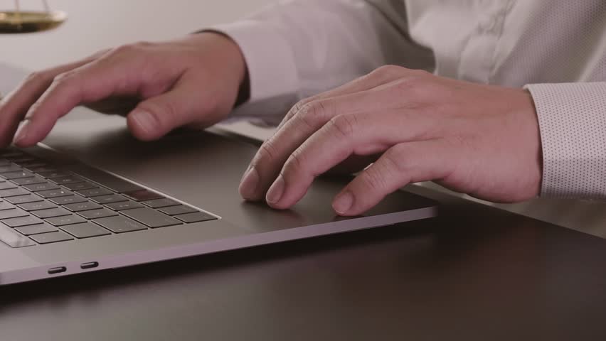Lawyer working with laptop computer in office in slow motion | Shutterstock HD Video #1006995697