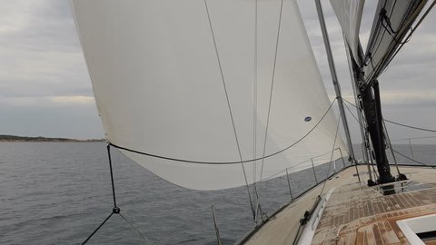 PORTO ROTONDO – JUNE 3: Open jib of a sailing boat navigating on June 3, 2017, in Porto Rotondo, Italy