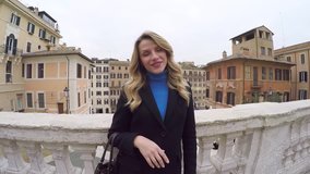 ROME, ITALY - JANUARY 31, 2018: Blond amazing woman near the Spanish steps in Rome, Italy. Video by Gopro camera