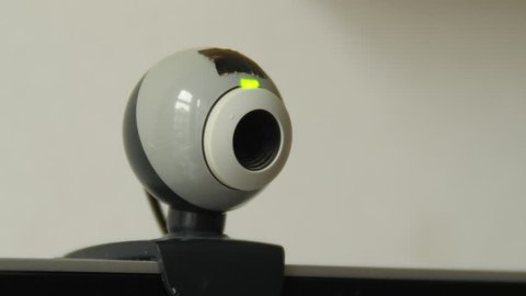 Webcam turning on by showing green light.