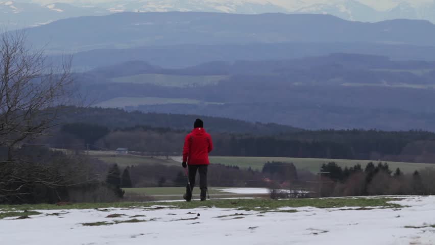 BLACK FOREST GERMANY - Man makes Nordic walking in front of the panoramic view of the Swiss Alps
