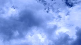 Time lapse clip of white fluffy clouds over blue sky, Beautiful white clouds soar across the screen in time lapse fashion over a deep blue background. ULTRA HD, 3840x2160. White clouds running.