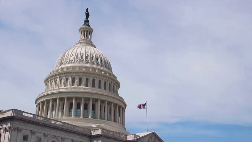 US Capitol Building dome with waving American flag in Washington D.C. Royalty-Free Stock Footage #1007025262