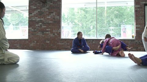 Children practicing Jiu-jitsu moves