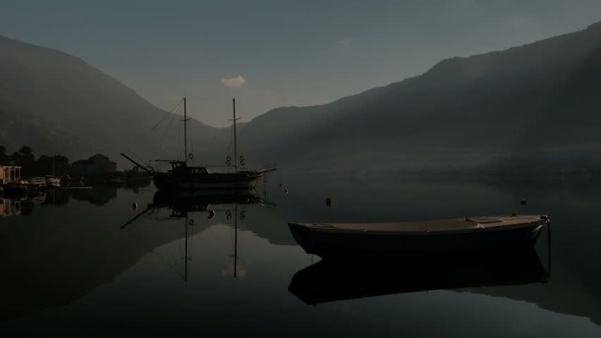 Boat in the Bay of Kotor, Dobrota.  View of the mountains in Montenegro