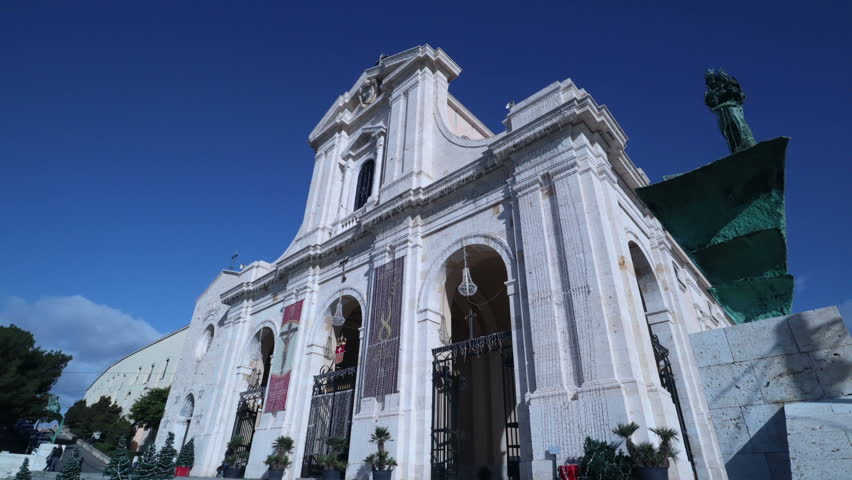 Cagliari, Sardinia, Italy - January 2 2018: pilgrims in front of the Basilica of Our Lady of Bonaria in Cagliari