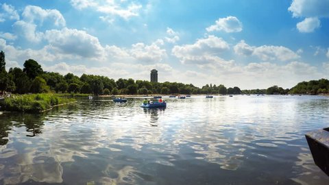 LONDON, ENGLAND - 17 June, 2017: Boats floating in the pond in Hyde Park on a sunny day