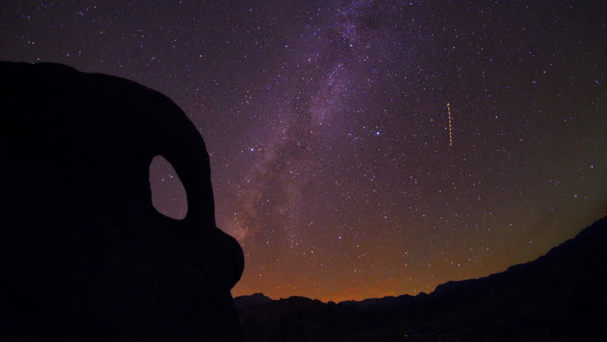 Universe time lapse of milkyway moving across the night sky - Mobius Arch Loop Trail, California