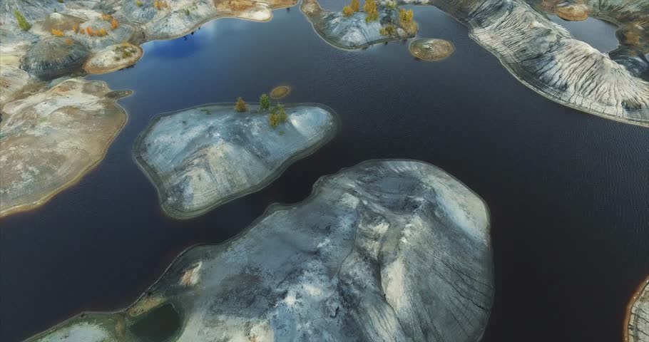 Shallow water near the sea at sunset. Footage. Aerial view. Sand island top view