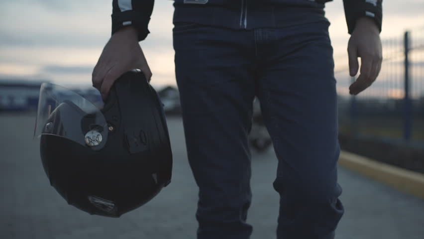 young attractive motorcyclist with black helmet on street. Man motorcycle biker  Royalty-Free Stock Footage #1007050375