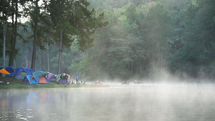 Morning fog and Camping tents under pine trees in Pang ung lake.