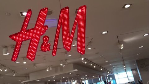 BANGKOK - DEC 2017: H&M store in the Siam Paragon shopping mall. Hennes & Mauritz AB is a Swedish multinational clothing retail company known for its fast fashion clothing for men, women, teenagers