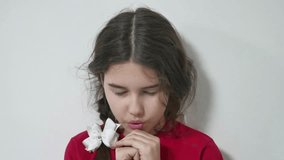 Beautiful young girl kid praying. little girl pray indoors religion