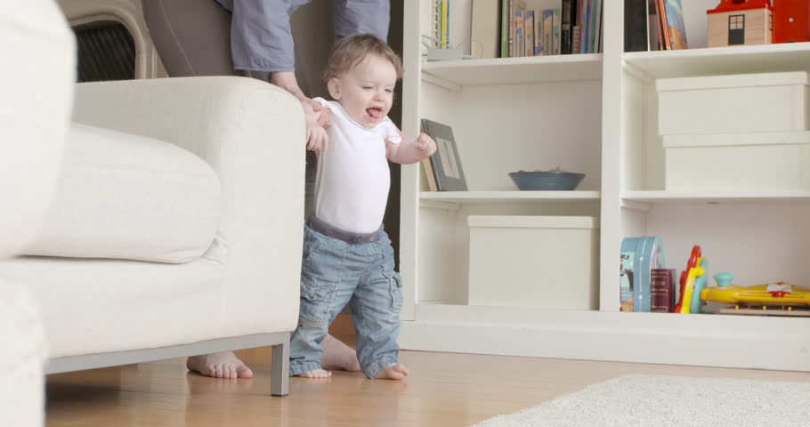 baby walking around furniture