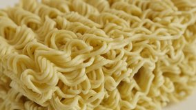 Slow tilt on instant food block 4K 2160p 30fps UltraHD footage - Surface of Chinese type noodles 3840X2160 UHD tilting video