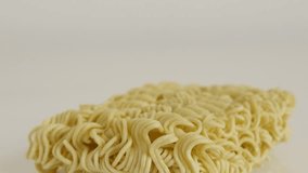 Dried Chinese type of noodles 4K 2160p 30fps UltraHD tilting footage - Instant staple food block slow tilt 3840X2160 UHD video