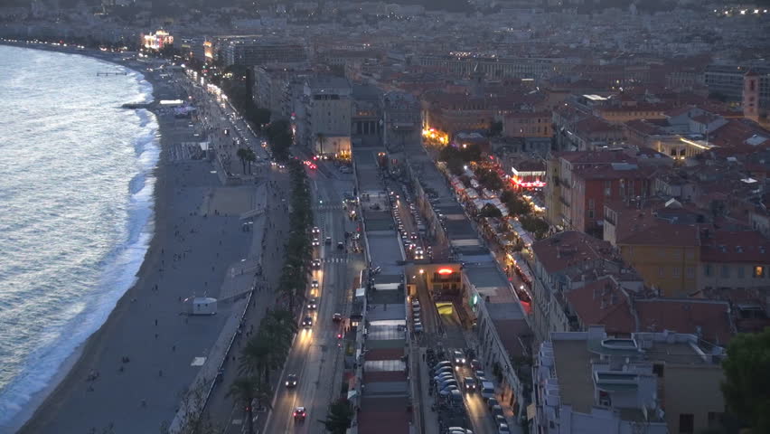 NICE, FRANCE - SEPTEMBER 9, 2013, Aerial view of beautiful downtown at twilight, heavy traffic car on boulevard