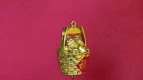 Chinese New Year : Golden ingot decoration with Chinese text language means of lucky and wealth on red background