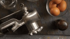 Flour and eggs, meat grinder and sieve. Video