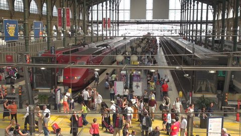 PARIS, JULY 24, 2013, Panoramic viewpoint of busy train platform in Gare du Nord 
