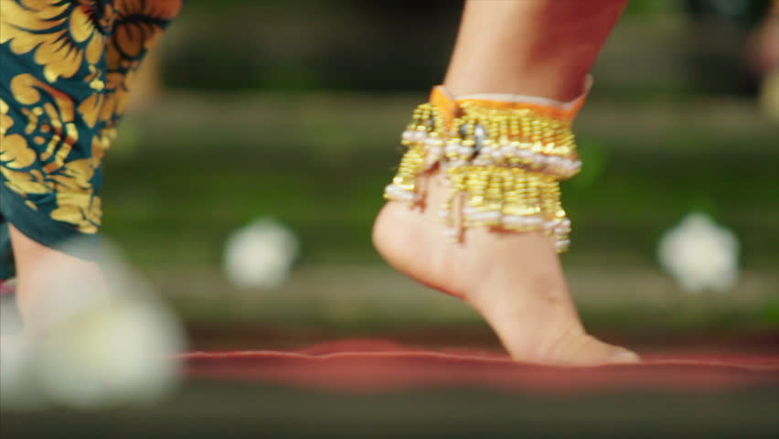 10 march 2015 Indonesia, Bali, Ubud. Clos-up artists legs in colorful costume dancing traditional balinese show