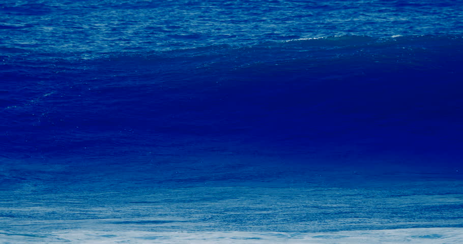 Slow motion close up of big ocean surf wave moving, breaking, crashing, tropical Hawaii shore beach. Deep blue sea water and whitecap of barrel tube splashing, spraying. Nature power slomo background  Royalty-Free Stock Footage #1007074537