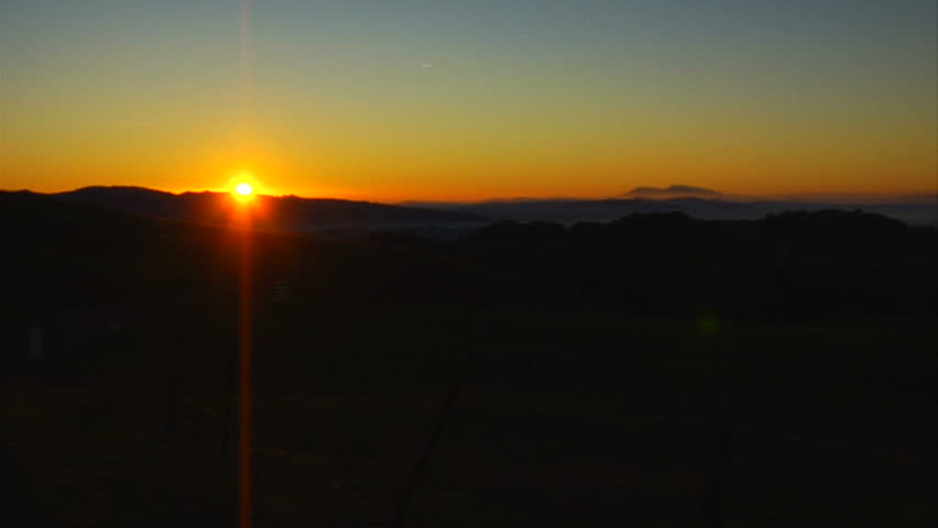 This is a wide locked off shot of a golden Napa Valley sunrise. Timelapse shows