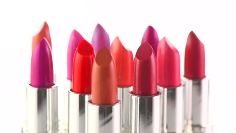 Lipstick. Fashion Colorful Lipsticks rotated over white background. Lipstick tints palette, Professional Makeup and Beauty. Beautiful Make-up concept. Lipgloss. Lipsticks closeup