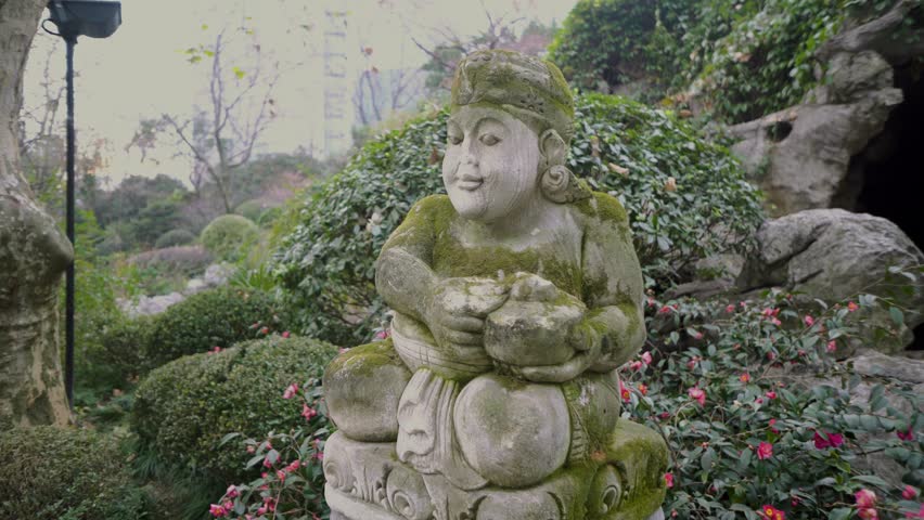 statue of a woman in a chinese park