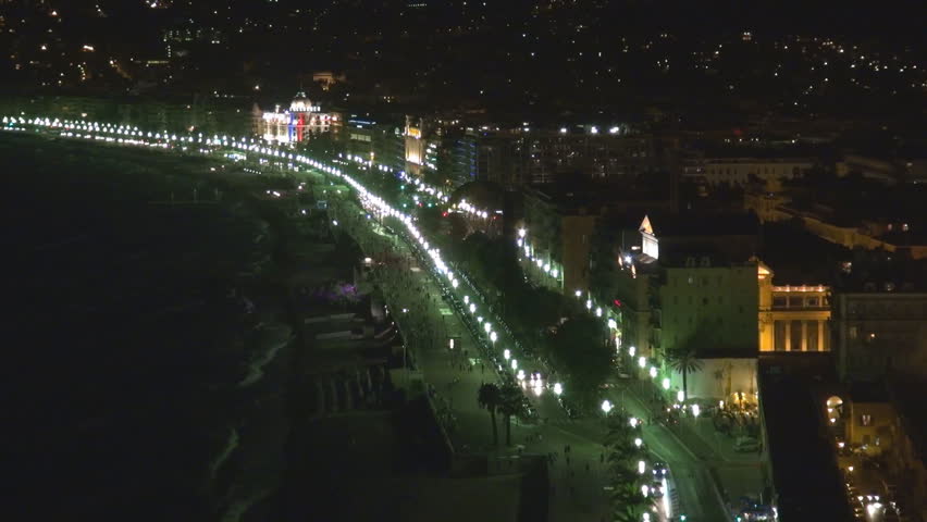 NICE, FRANCE - SEPTEMBER 9, 2013, Aerial view of illuminated Negresco hotel building and traffic night car