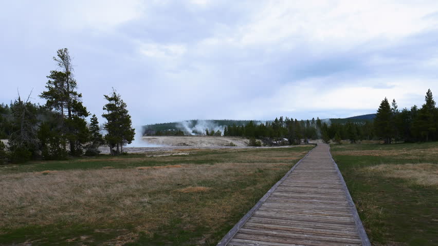 Walkway  overlooking hot springs in the West Thumb Geyser Basin at Yellowstone National Park in Wyoming, USA
