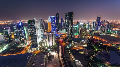 Doha Qatar skyscrapers tall buildings timelapse night lights downtown streets cars moving fast beautiful, Middle East