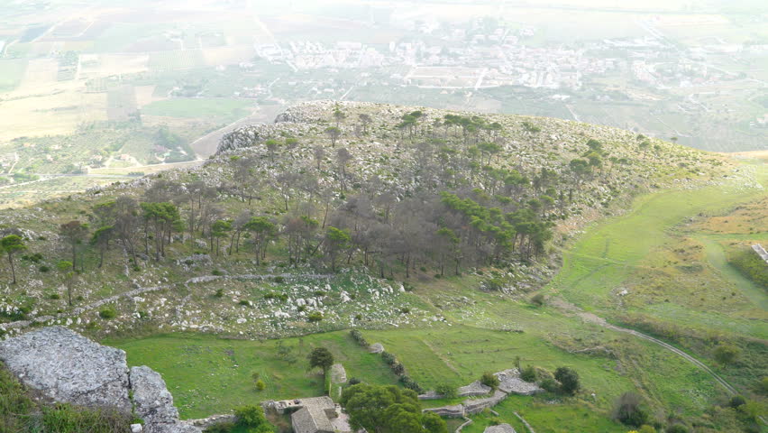 Overlooking view of the green grasses in the field of Erice Trapani the view from the top of the village in the mountain in Italy
