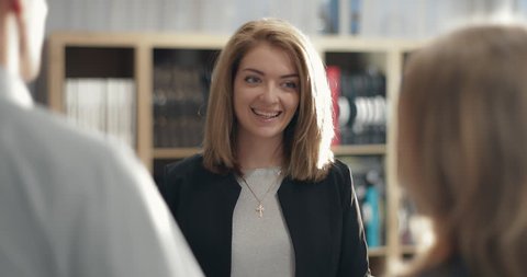 Businesswoman meets partners in her office. in slow motion