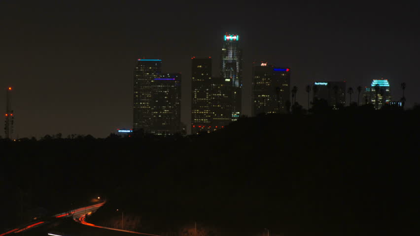 zooming timelapse shot of downtown Los Angeles and the 110 freeway from Highland