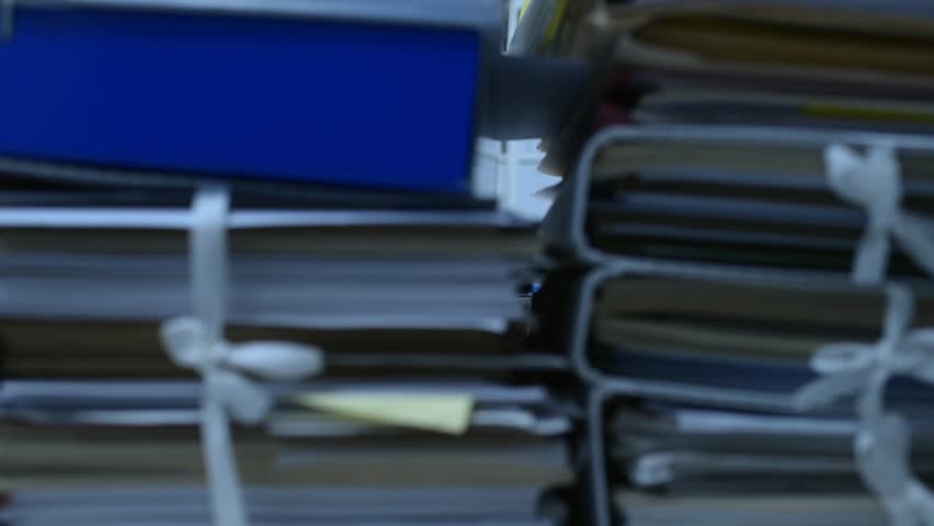 Frustrated overworked office worker hitting his head on a pile of paperwork: stress and work overload concept Royalty-Free Stock Footage #1007116519