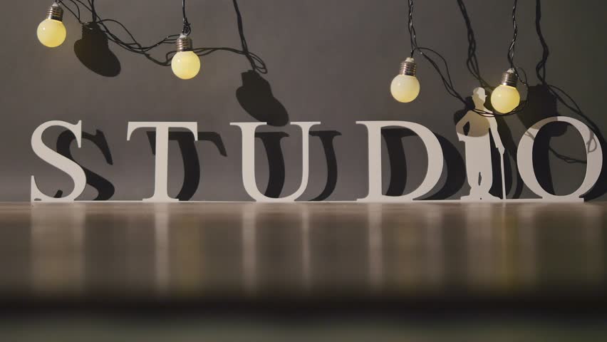 Light bulbs garland close up. Electric bulb shine hanging on wall as decoration for holiday close up
