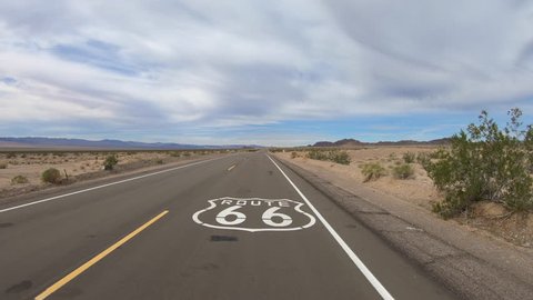 Aerial fly over of Route 66 pavement sign in the California Mojave desert.