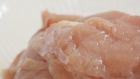 Raw chicken breasts in a box slow pan 4K 2160p 30fps UltraHD  video - Frozen food packed close-up 3840X2160 UHD panning footage